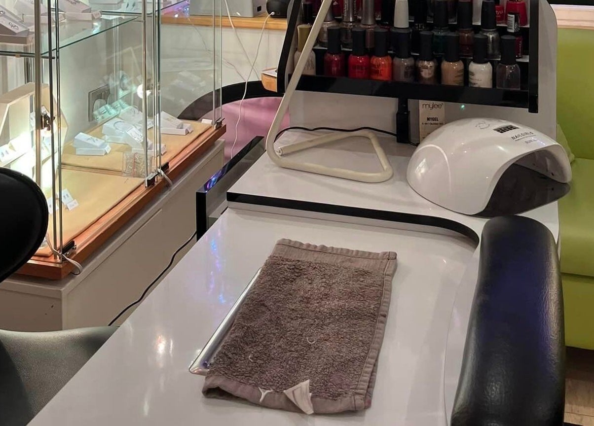 Nail care station at Barnham Health and Beauty in Barnham, England, GB displaying polish selection and tools.