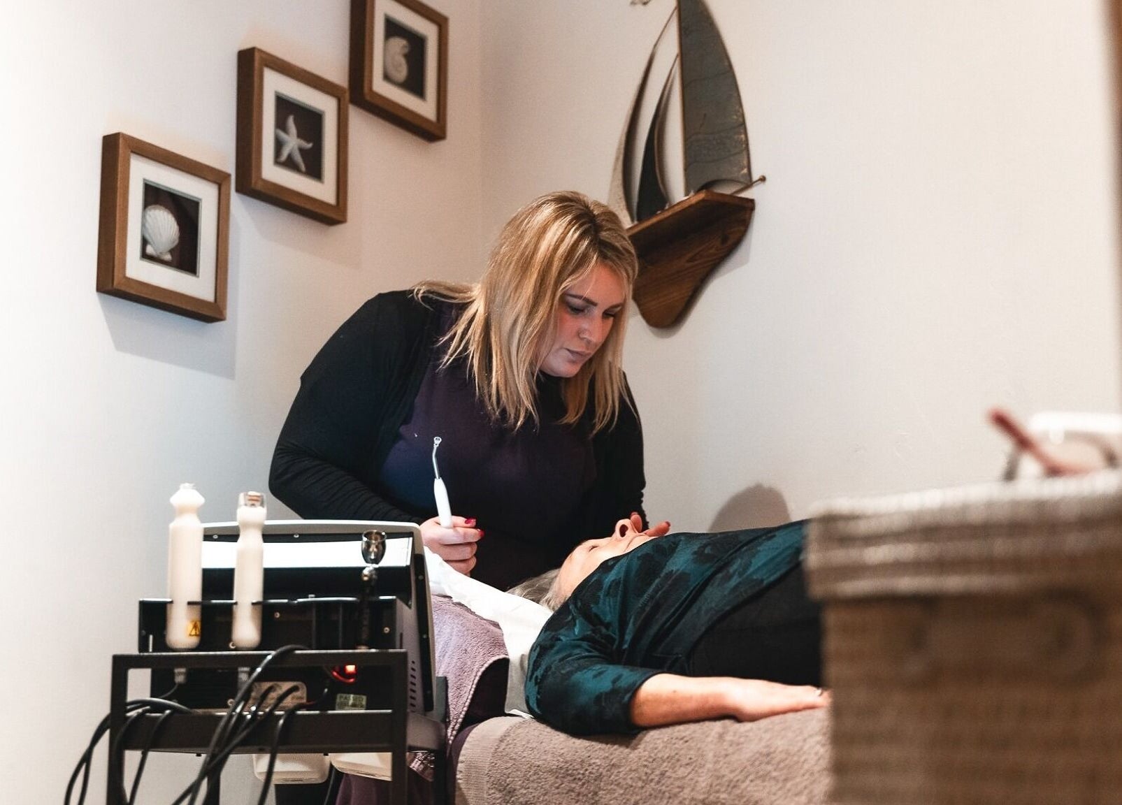 Therapist performing facial at Barnham Health and Beauty, Barnham, England, GB. Relaxation and wellness.