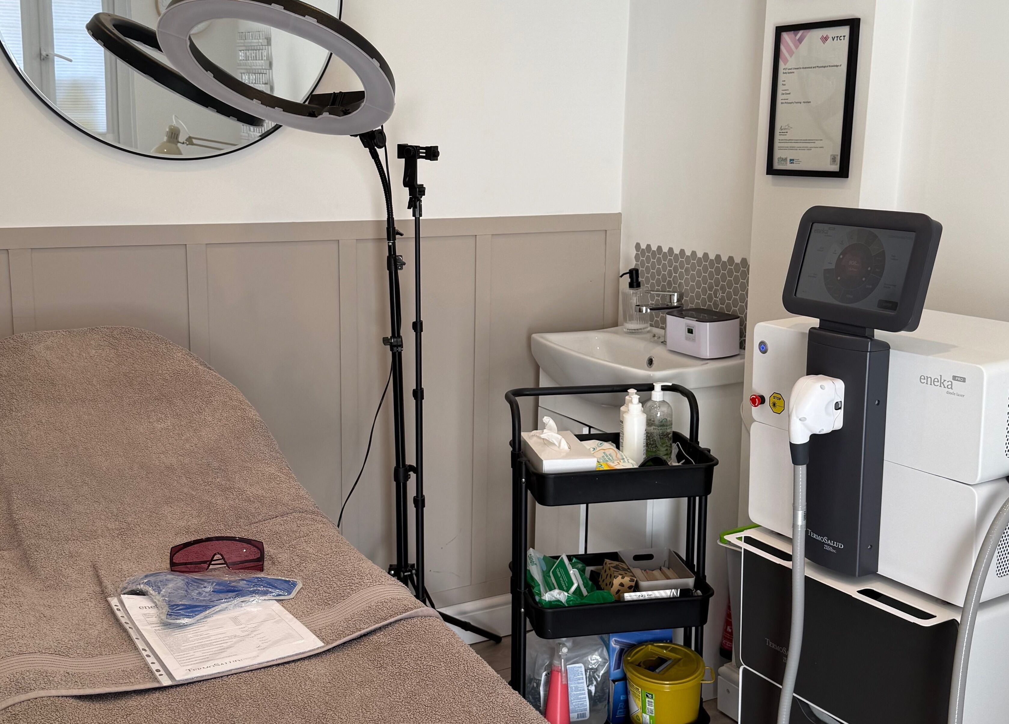 Cozy treatment room at The Beauty Lounge, Thatcham, England, GB with modern equipment and soft lighting.