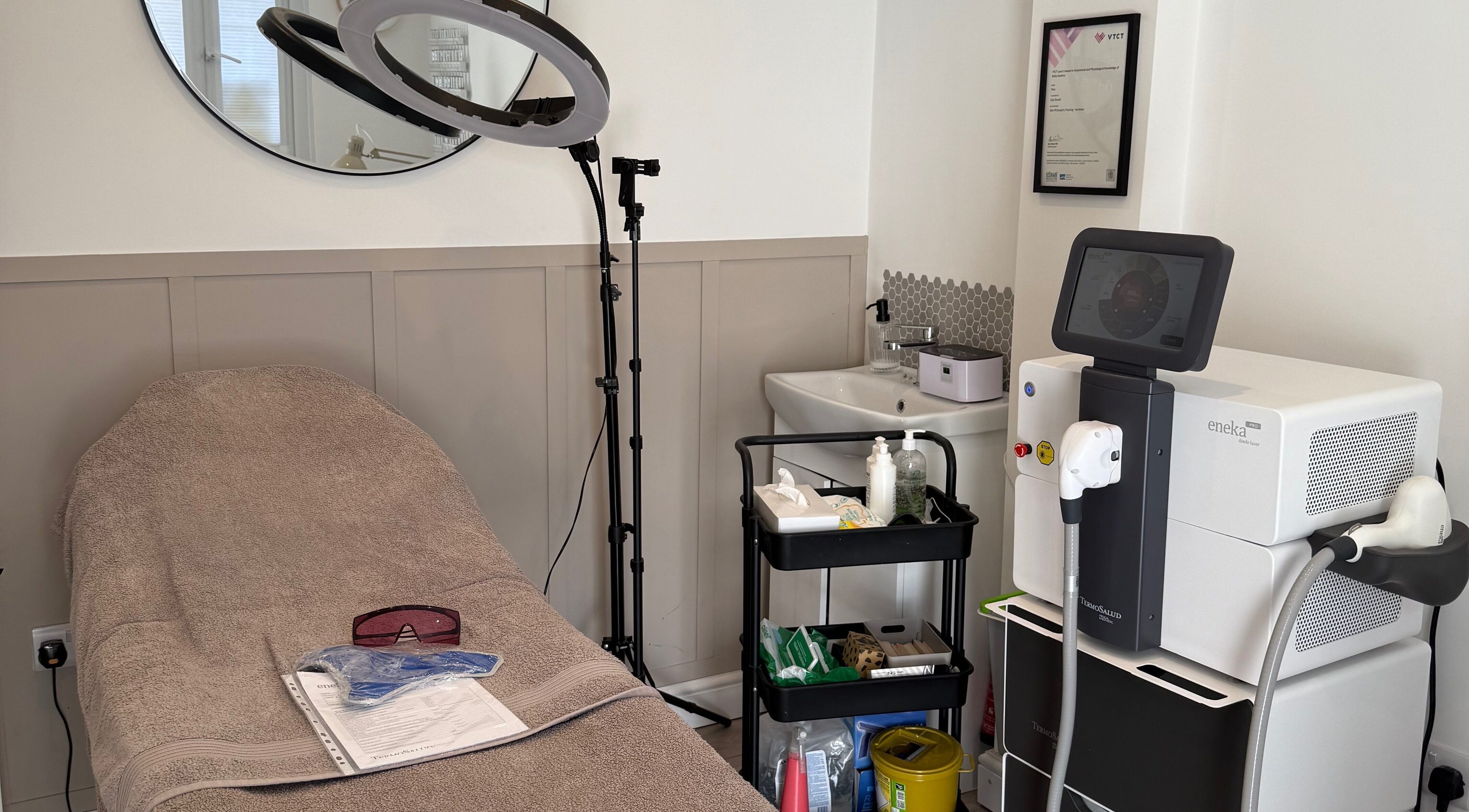 Cozy treatment room at The Beauty Lounge, Thatcham, England, GB with modern equipment and soft lighting.