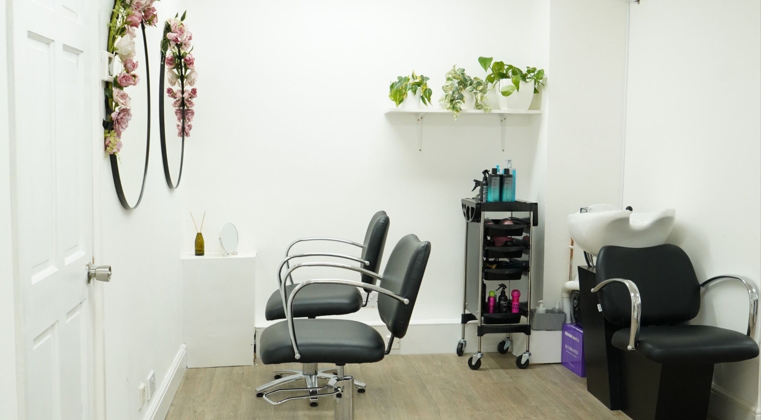 Modern salon interior at Precise in Southampton, England, GB, featuring chic chairs and elegant decor.