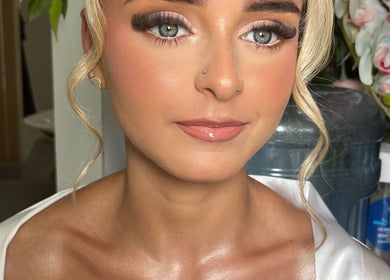 Makeup by Daisy showcases stunning bridal makeup in Widley, England, GB with soft curls and elegant eye makeup.