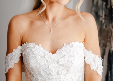 Bridal makeup by Makeup by Daisy, Widley, England, GB, showcasing a lace off-shoulder dress.