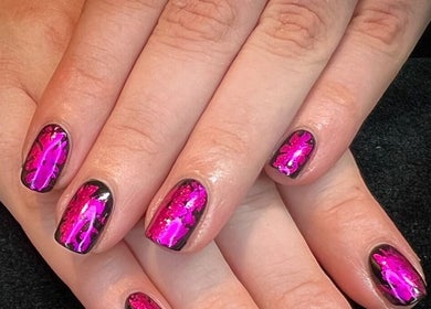Bright pink nail art at Got Nails, Harlow, England, GB. Showcasing intricate design on a polished surface.