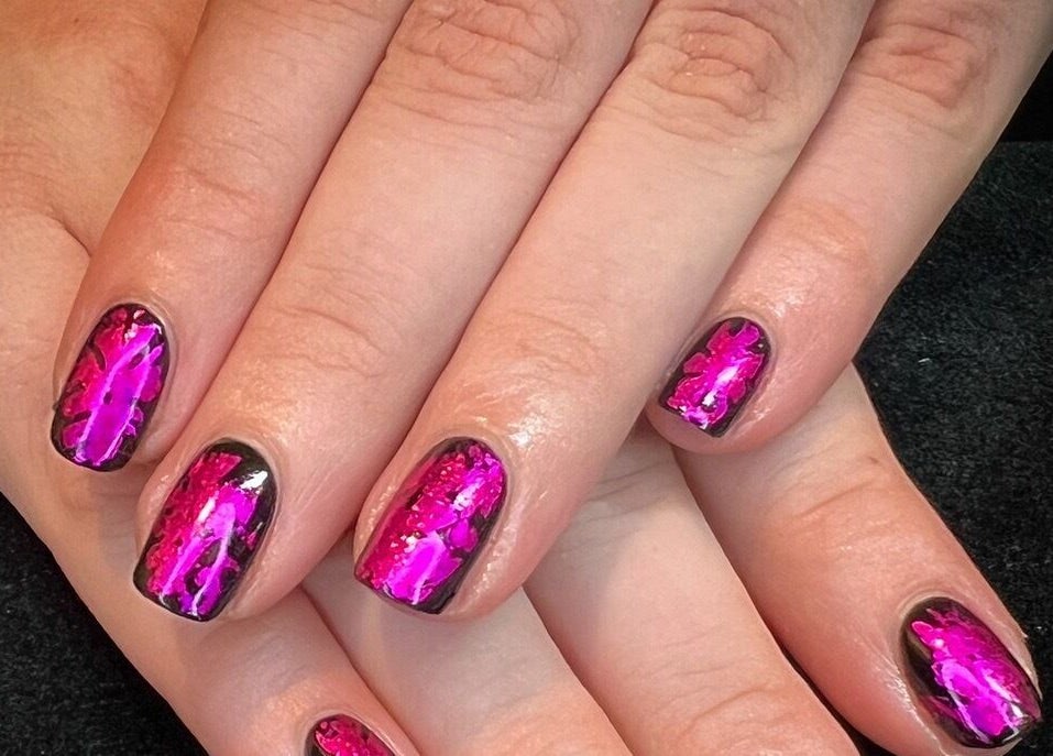 Bright pink nail art at Got Nails, Harlow, England, GB. Showcasing intricate design on a polished surface.