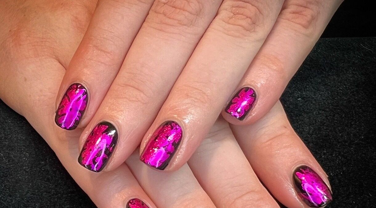 Bright pink nail art at Got Nails, Harlow, England, GB. Showcasing intricate design on a polished surface.