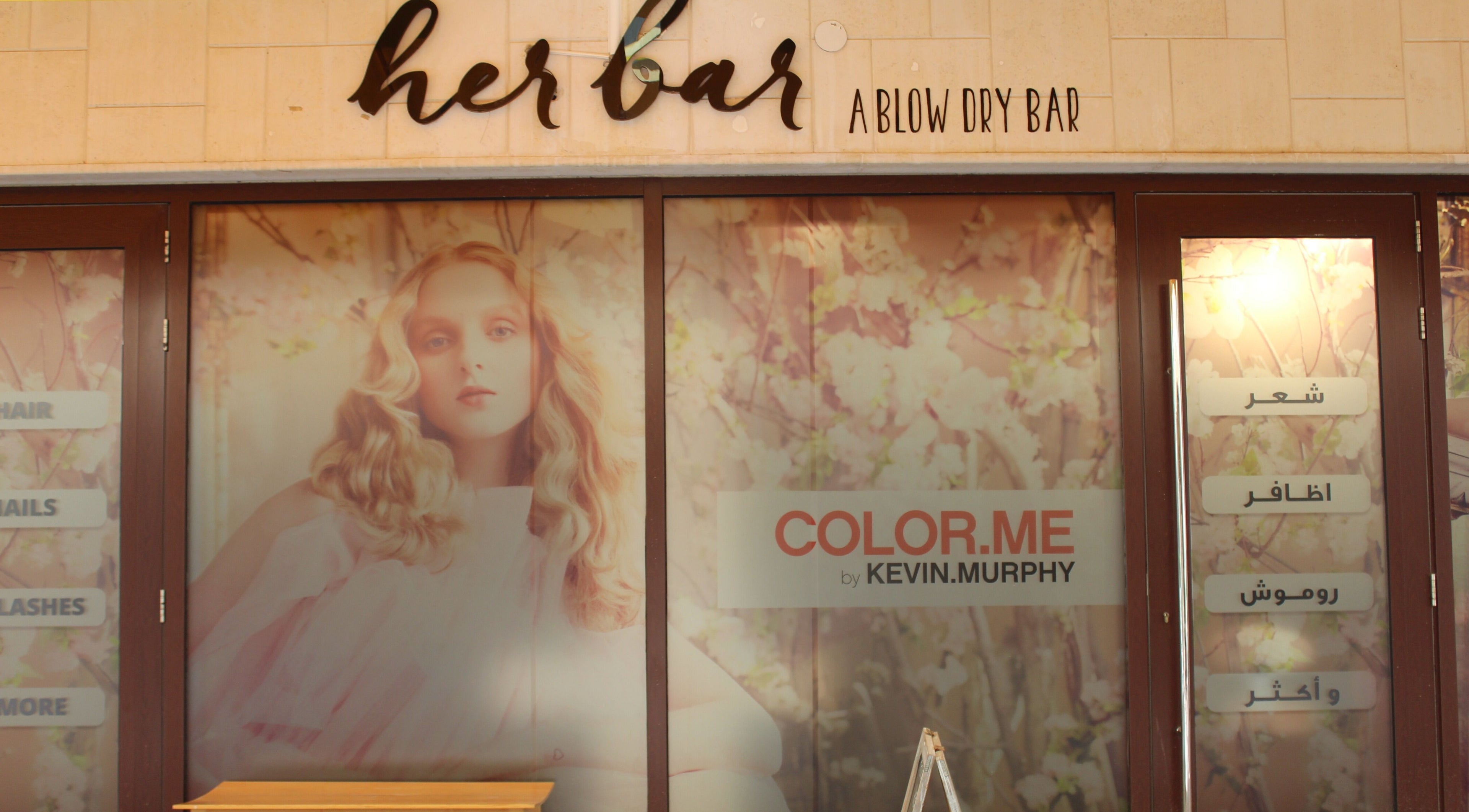 Her Bar entrance displaying elegant decor at Abu Dhabi, Abu Dhabi, AE, showcasing beauty service options.