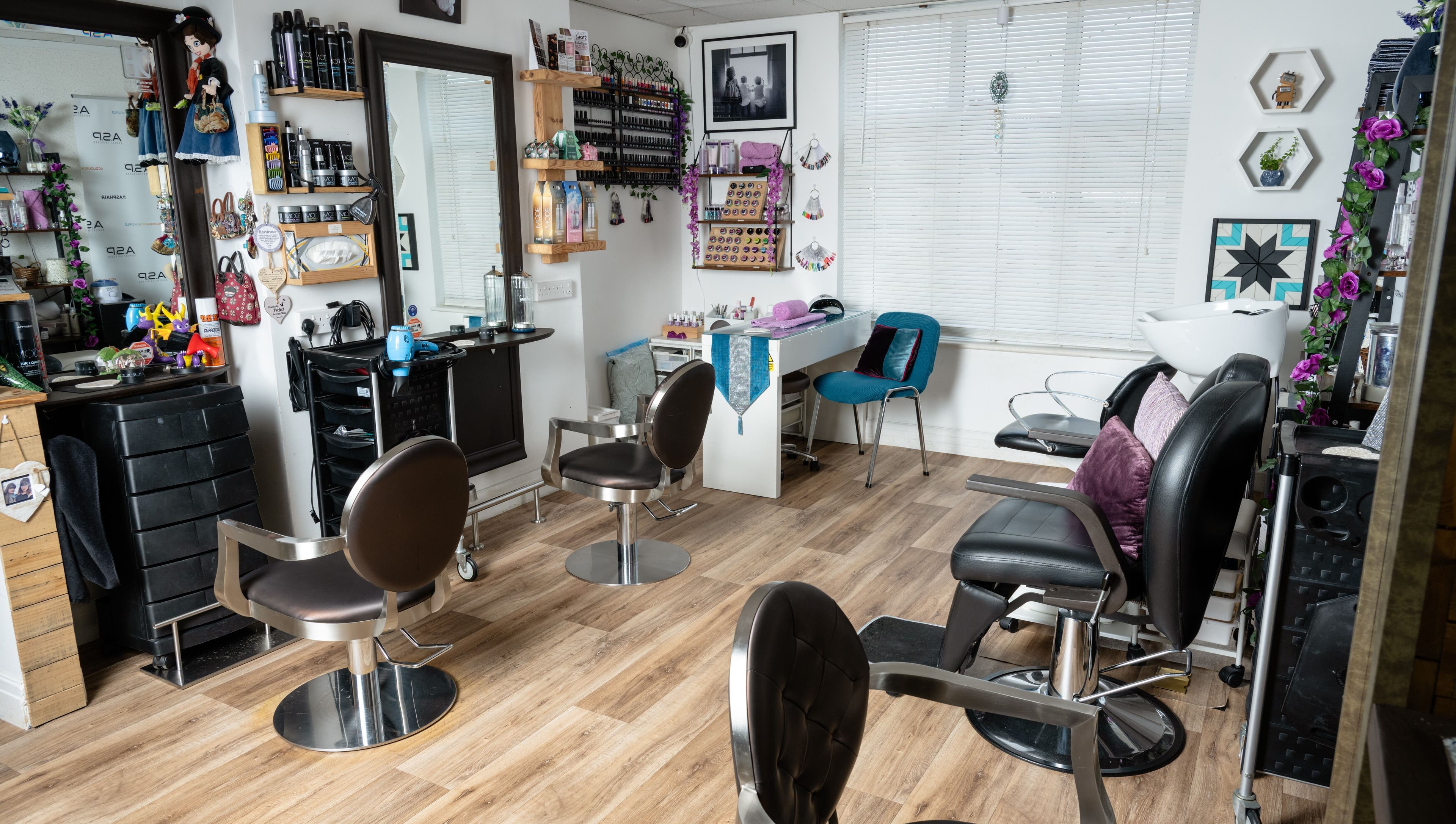 Interior of Pin and Pose Salon in Plymouth, England. Stylish chairs and decor reflect luxury and comfort.