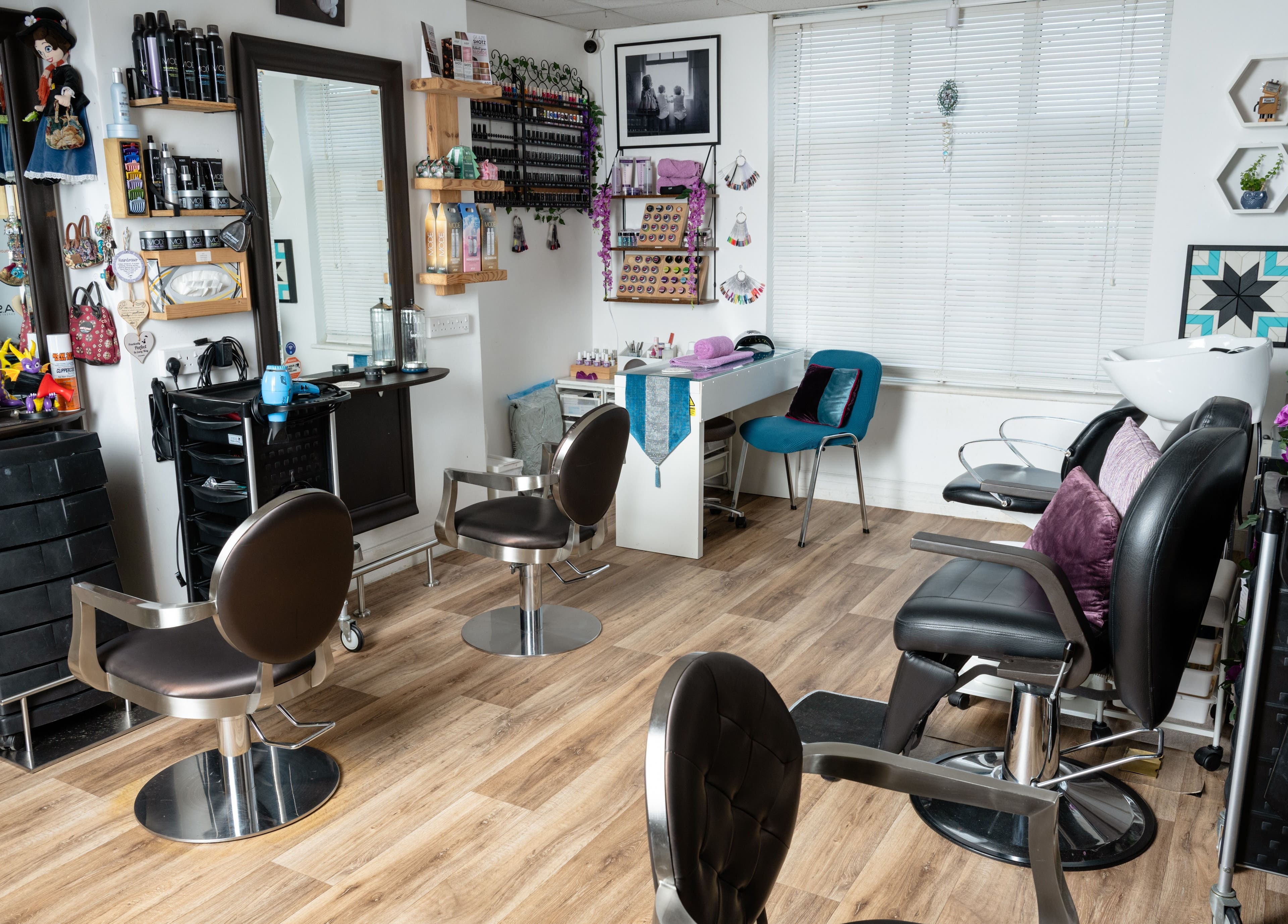Interior of Pin and Pose Salon in Plymouth, England. Stylish chairs and decor reflect luxury and comfort.