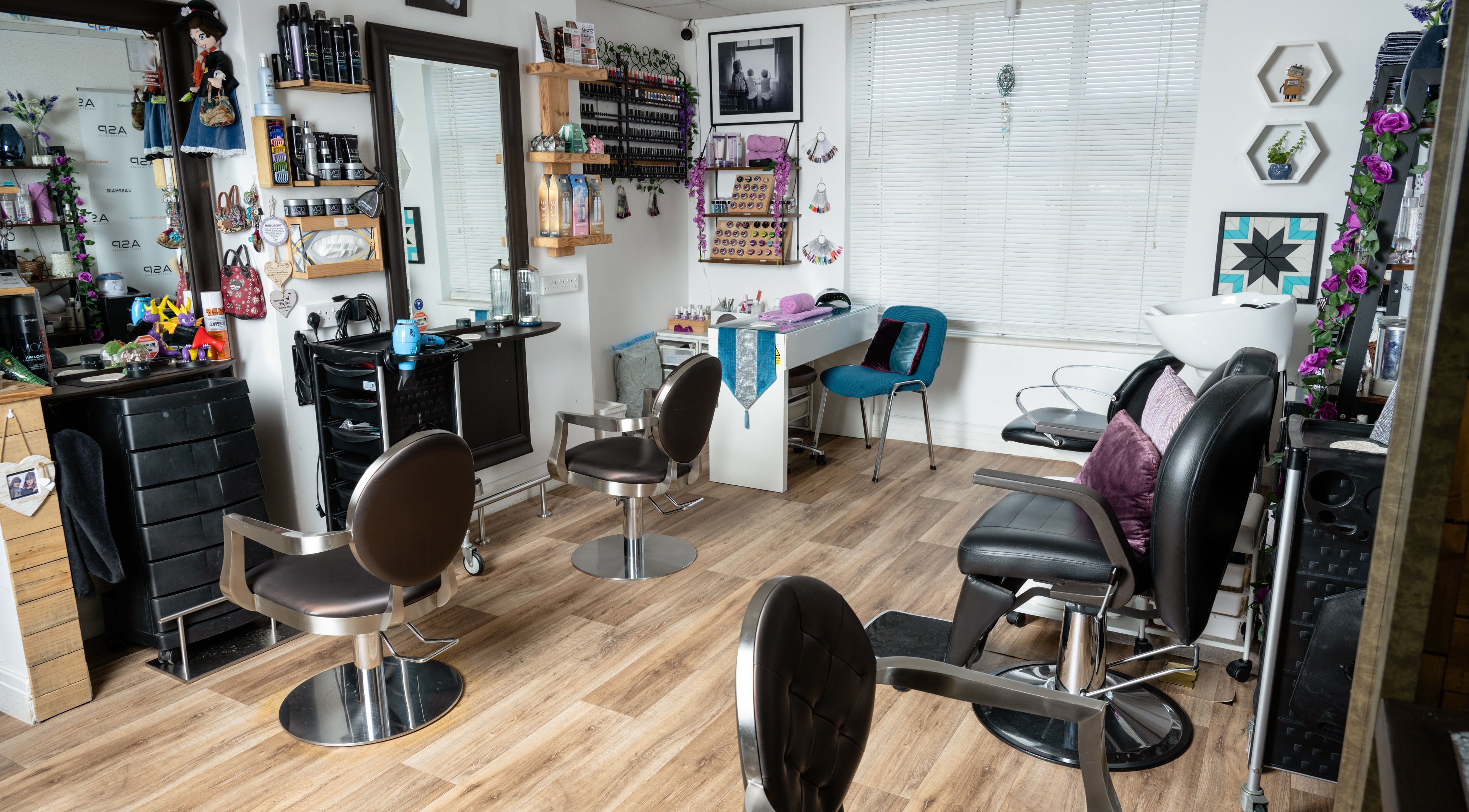 Interior of Pin and Pose Salon in Plymouth, England. Stylish chairs and decor reflect luxury and comfort.