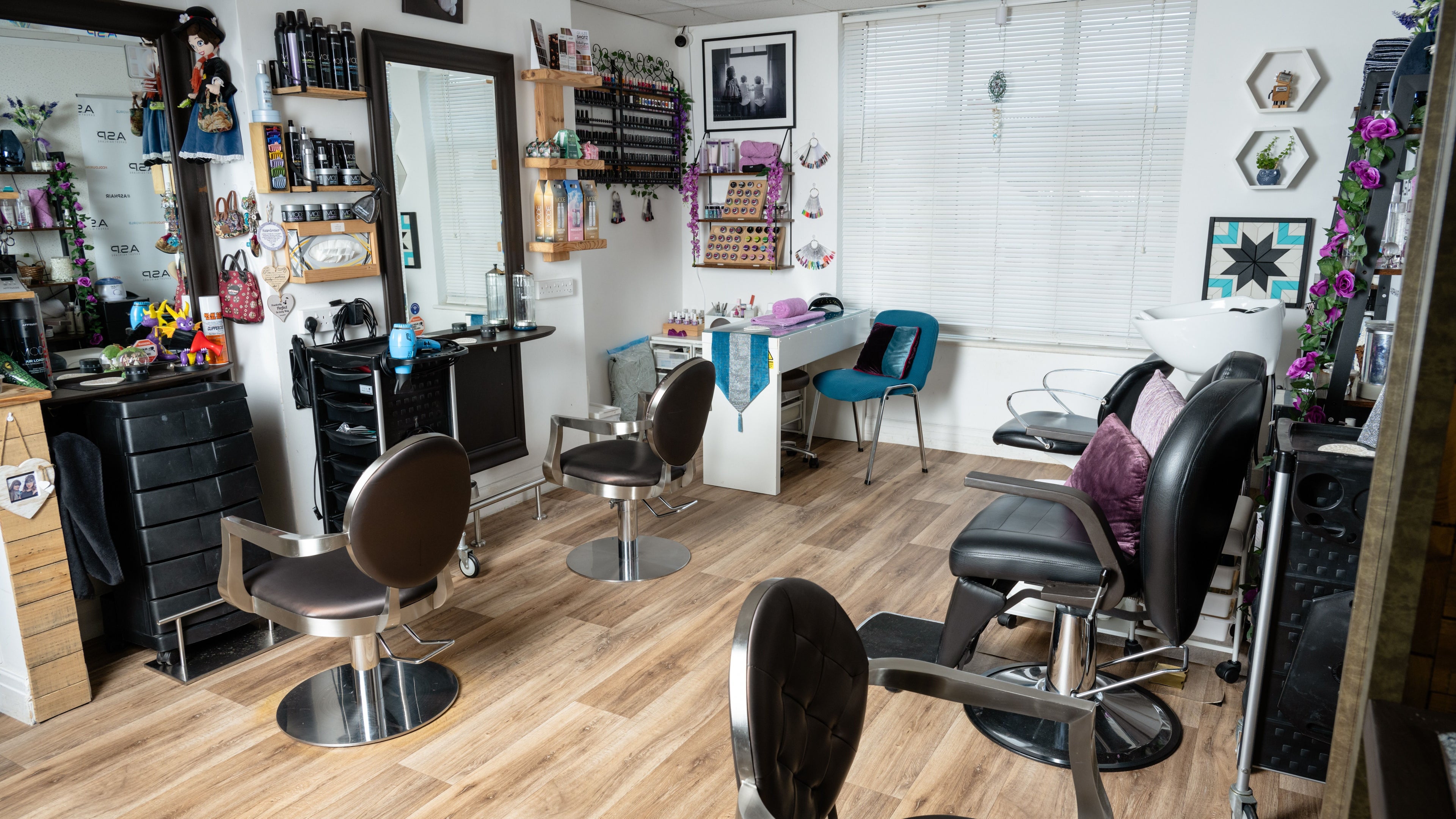 Interior of Pin and Pose Salon in Plymouth, England. Stylish chairs and decor reflect luxury and comfort.