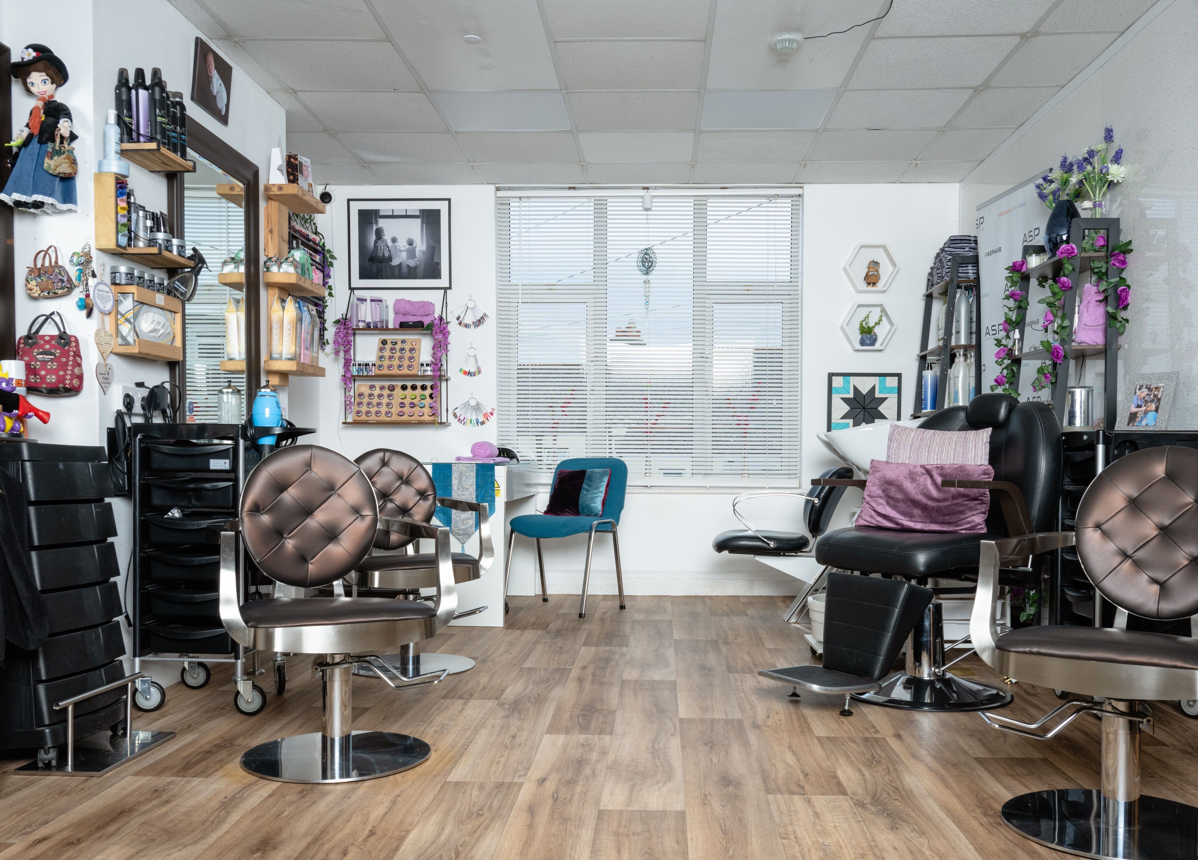 Interior of Pin and Pose Salon in Plymouth, England, GB featuring stylish chairs and decor.