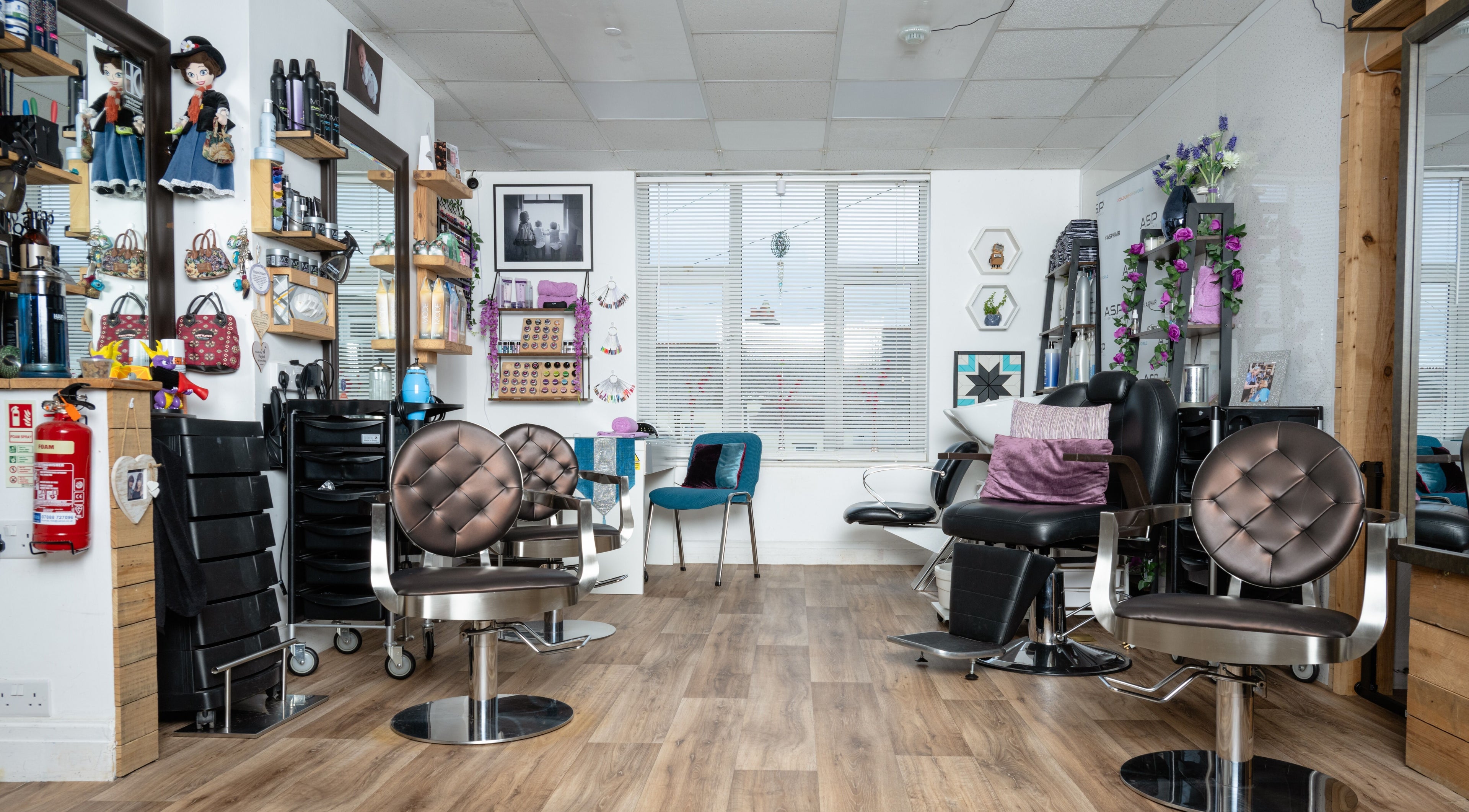 Interior of Pin and Pose Salon in Plymouth, England, GB featuring stylish chairs and decor.