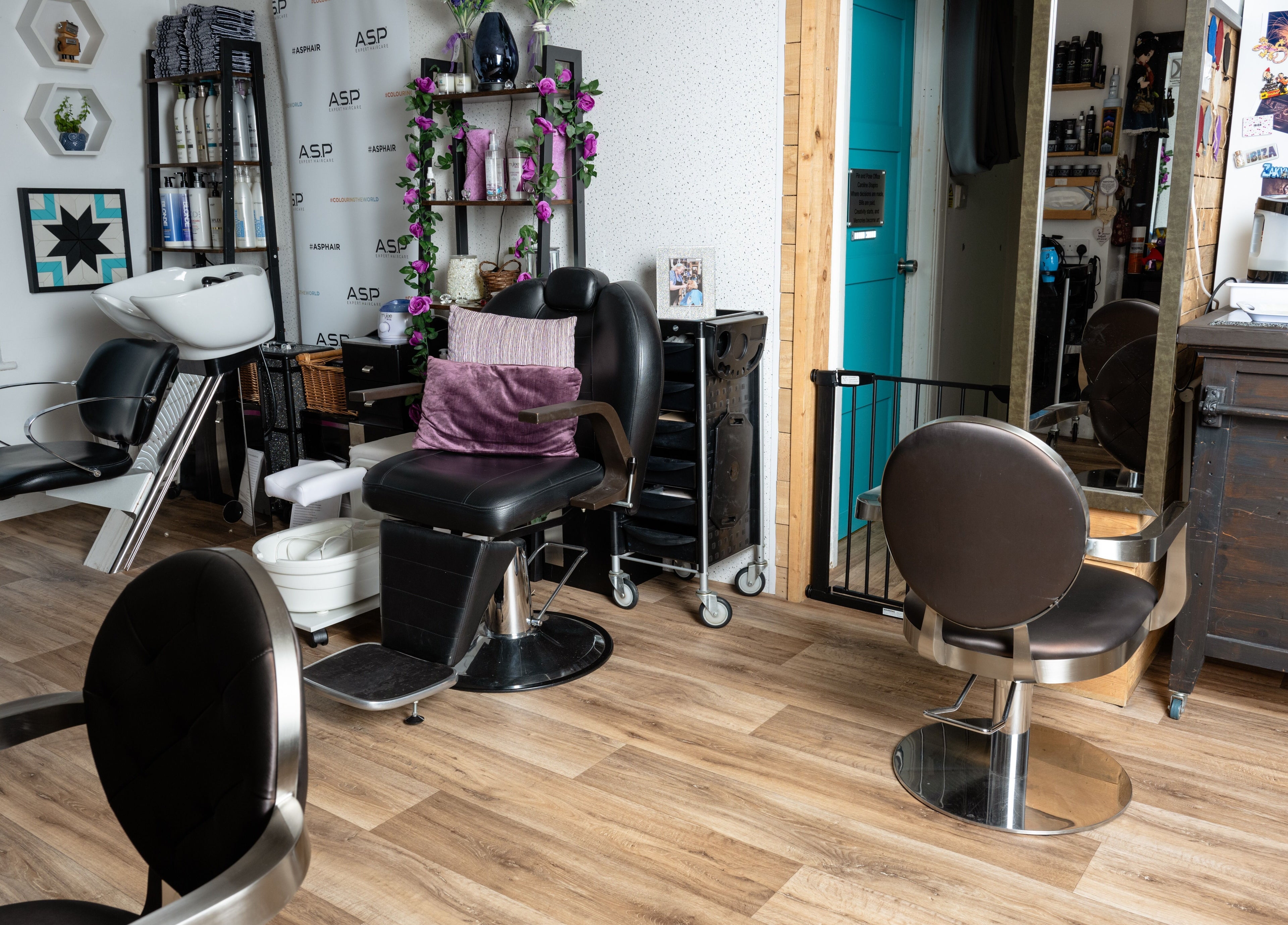 Modern styling chair and wash station at Pin and Pose Salon, Plymouth, England, GB, showcasing elegance and comfort.