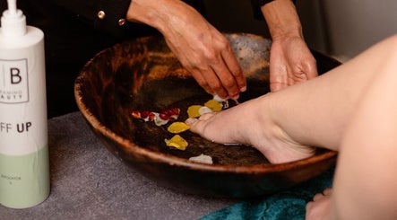 Relaxing footbath with petals at Intrinsic Hair & Beauty, Cape Town, Western Cape, ZA.