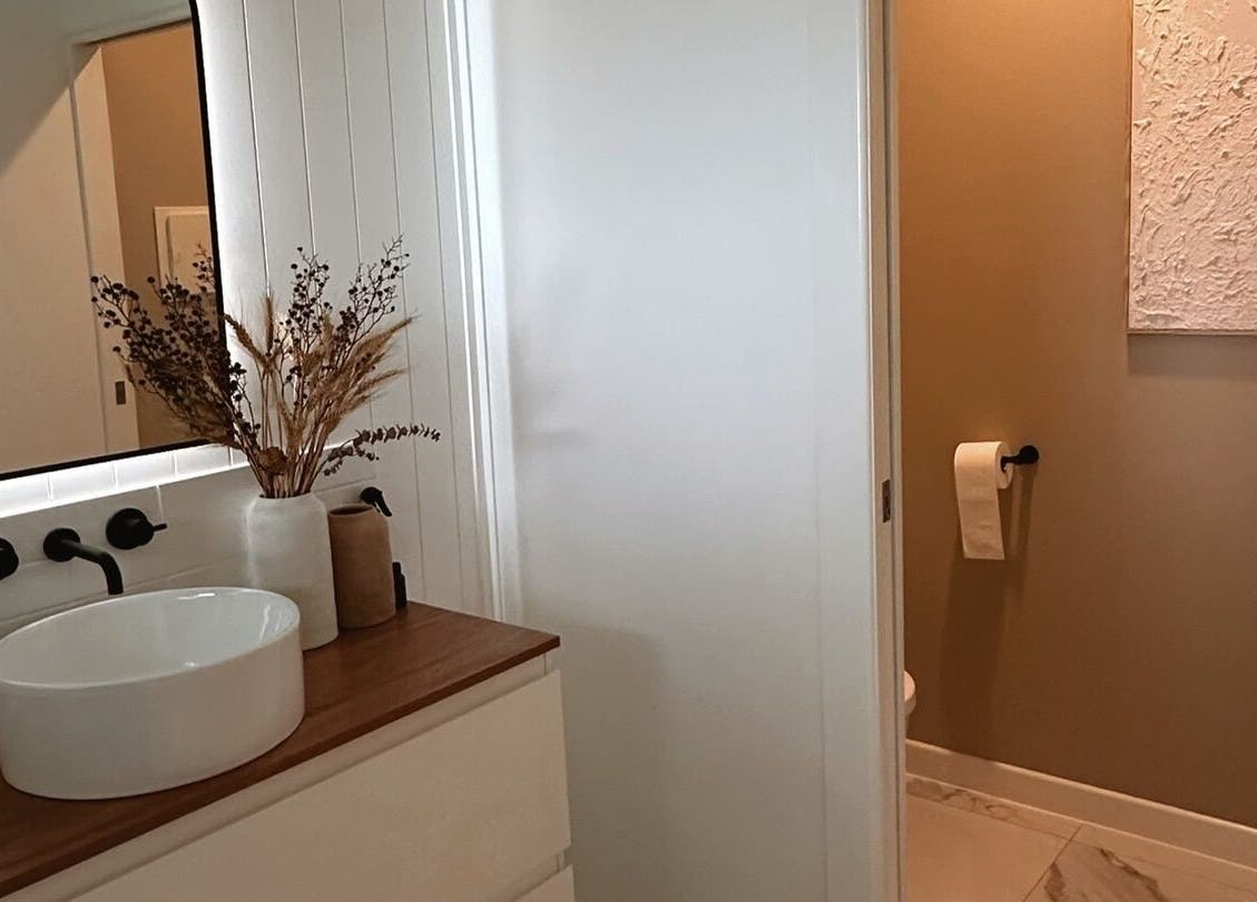 Luxurious bathroom at Beauté by Janita, Kiels Mountain, Queensland, AU. Modern sink and decor.