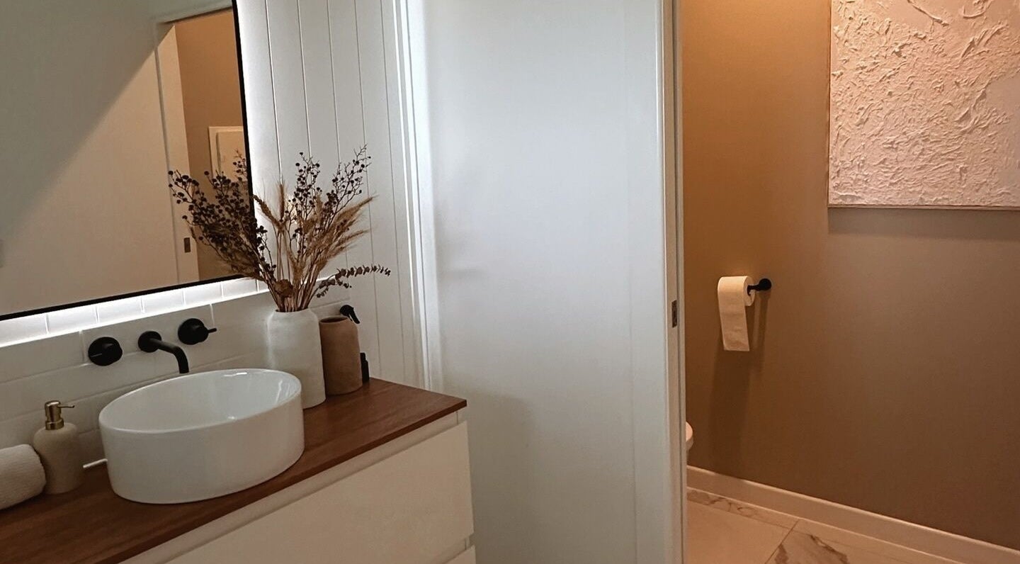 Luxurious bathroom at Beauté by Janita, Kiels Mountain, Queensland, AU. Modern sink and decor.