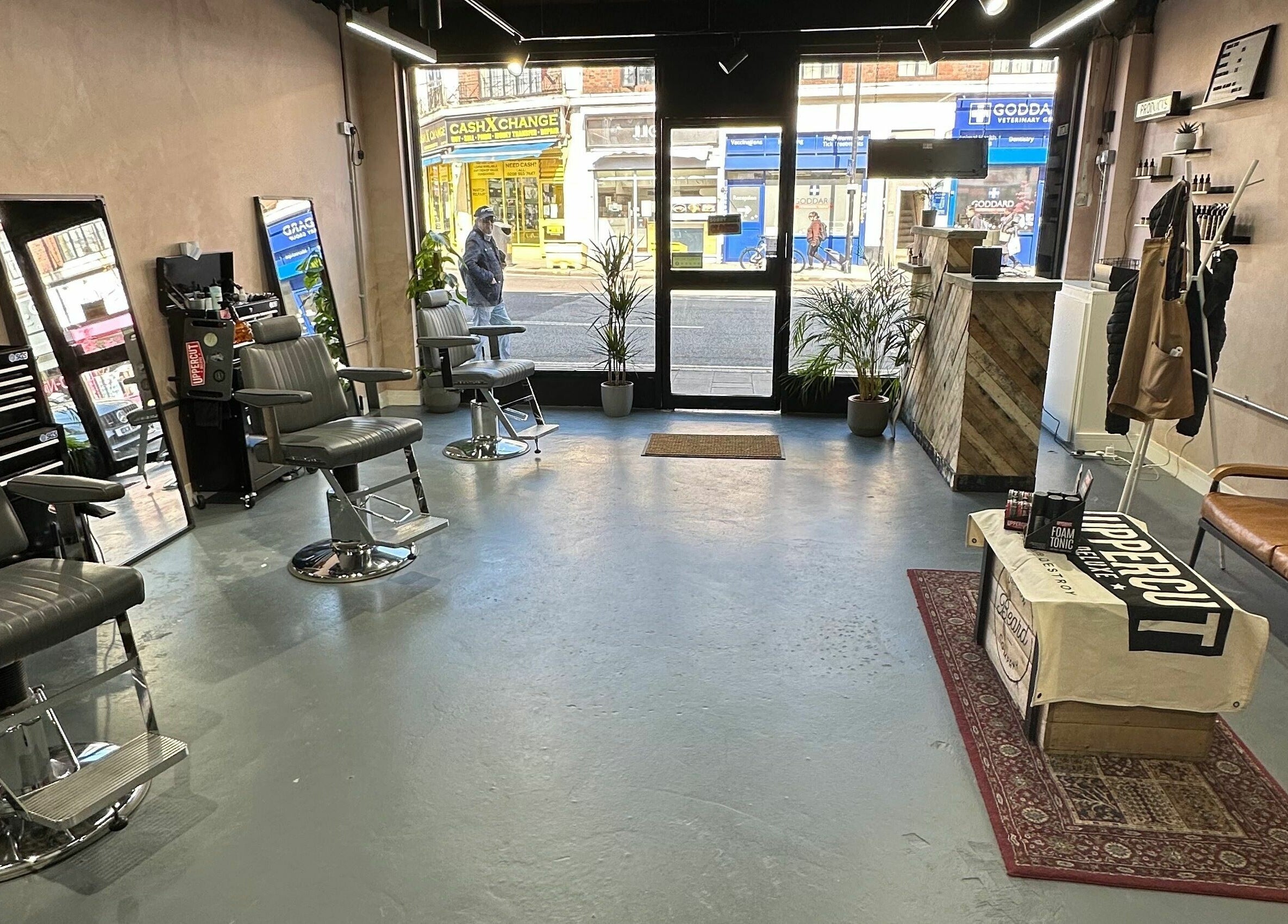 Interior of London Beard Co Barbershop Hackney, featuring chic chairs and modern decor in London, England, GB.