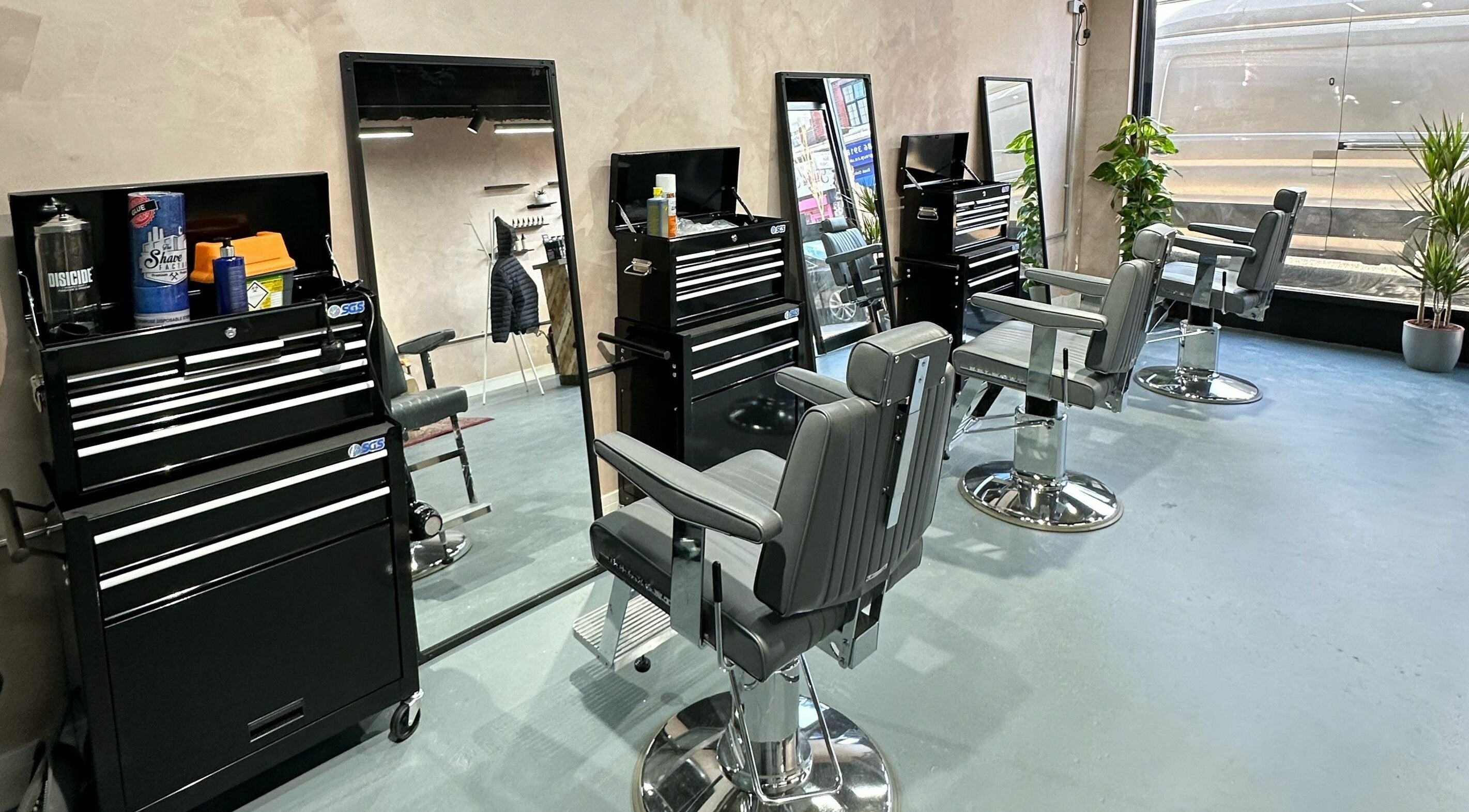 Modern barber chairs inside London Beard Co Barbershop Hackney, located in London, England, GB.