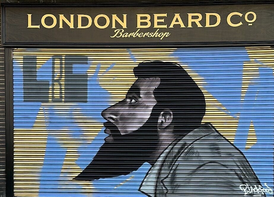 London Beard Co Barbershop Hackney storefront mural in London, England, GB, showcasing stylish beard art.