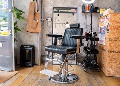 Modern interior at London Beard Co Barbershop Dalston, sleek chair and rustic decor, London, England, GB.