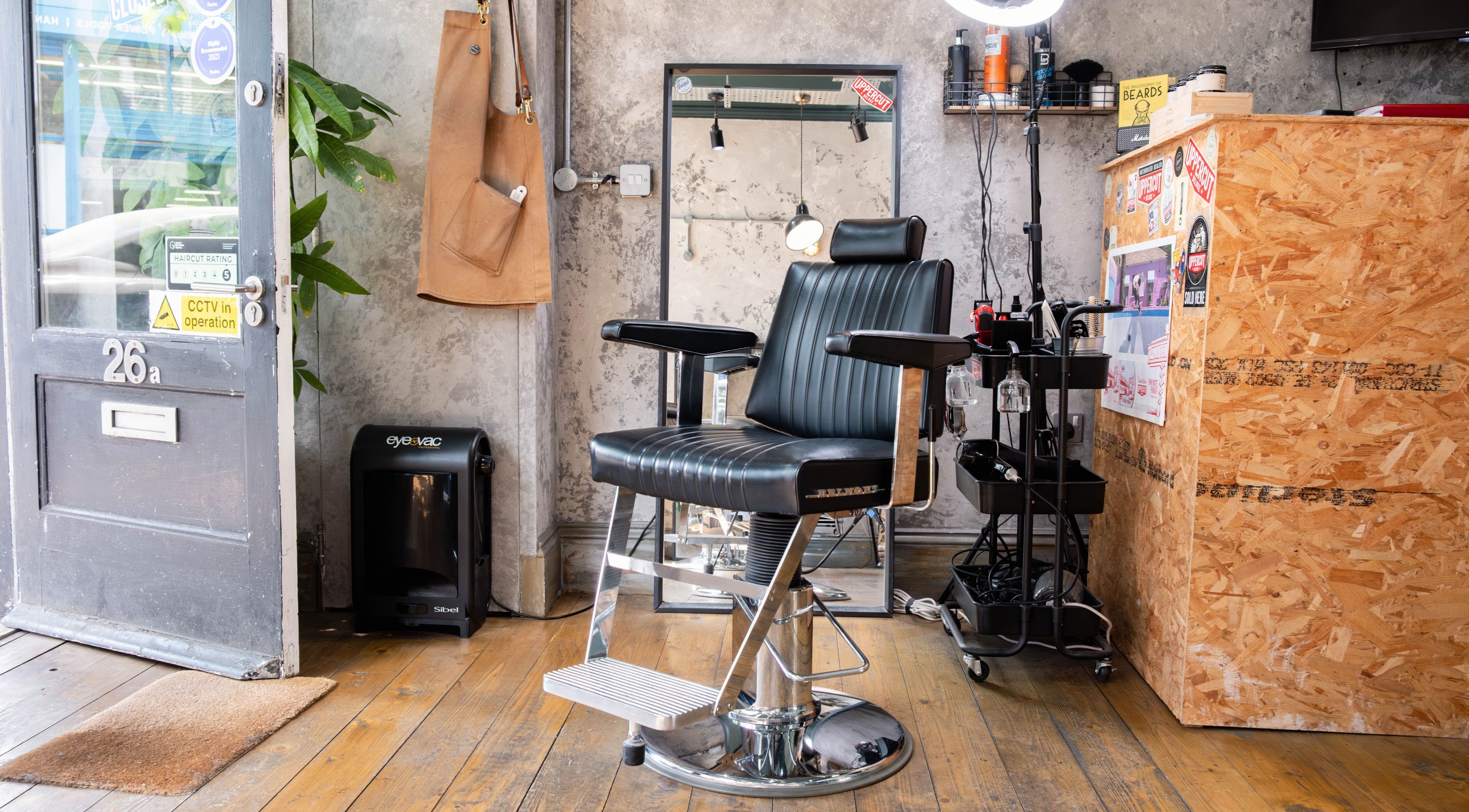 Modern interior at London Beard Co Barbershop Dalston, sleek chair and rustic decor, London, England, GB.