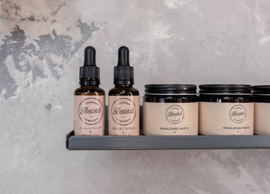 Grooming products at London Beard Co Barbershop Dalston in London, England, GB displayed on a shelf.