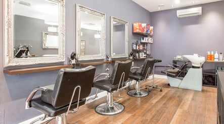 Elegant salon interior with styling chairs at Divine London Clinic, Northwood, England, GB.