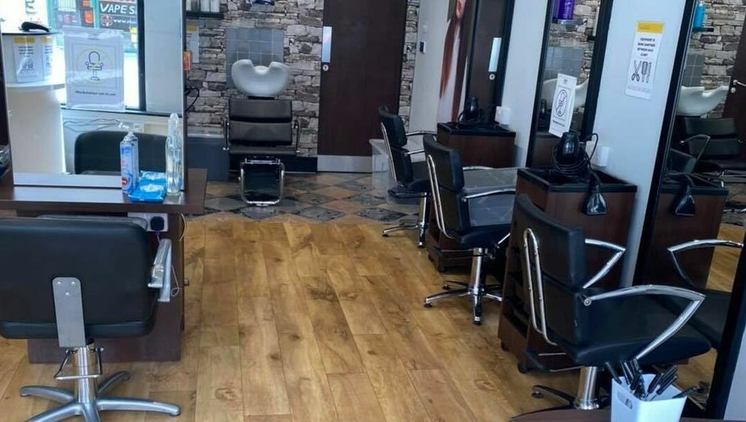 Modern interior of J F H Design, spa venue in Inverness, Scotland, GB, with stylish chairs and mirrors.