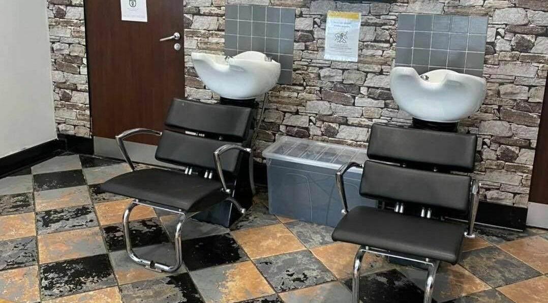 Modern salon wash stations at J F H Design, Inverness, Scotland, GB with sleek chairs and stylish decor.