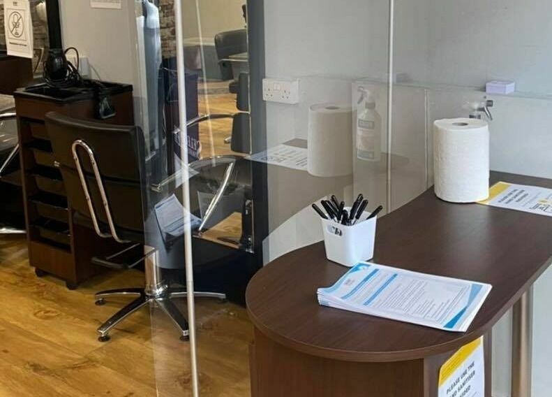 Modern salon station at J F H Design, Inverness, Scotland, GB with stylish chairs and work surfaces.