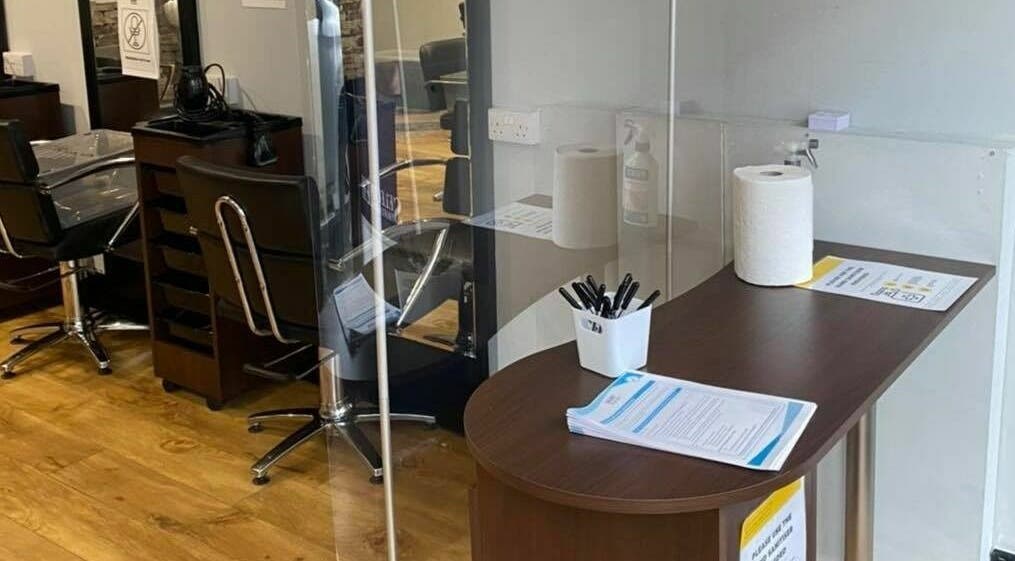 Modern salon station at J F H Design, Inverness, Scotland, GB with stylish chairs and work surfaces.