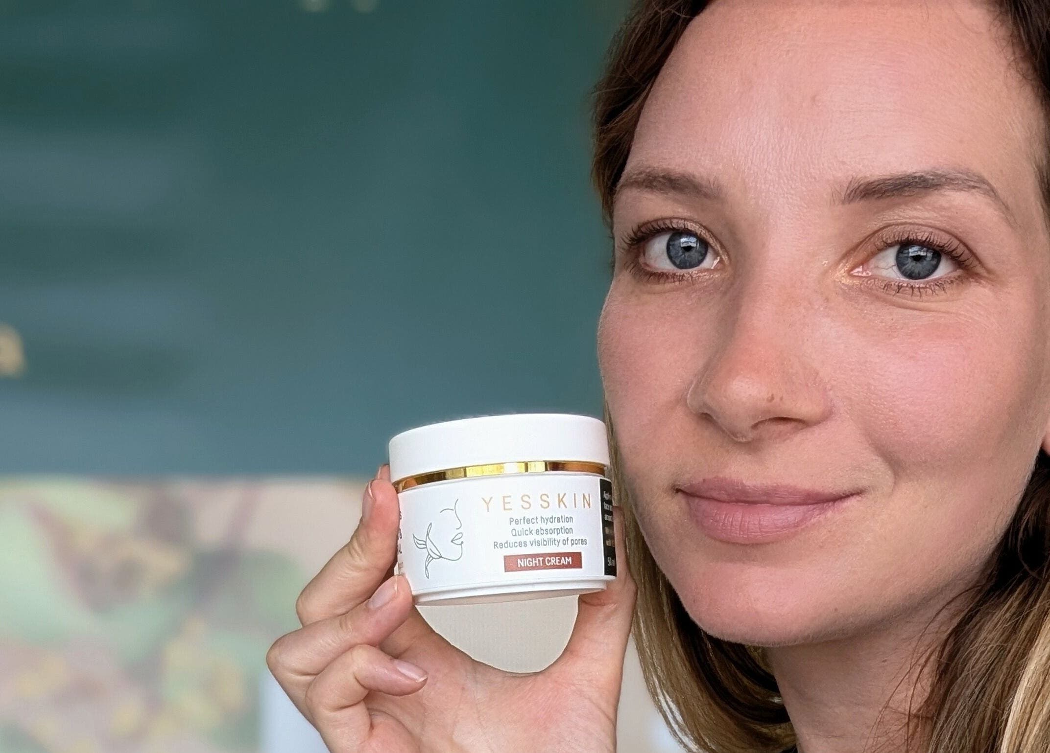 Woman holding Yesskin cream at Yesskin Skin Care, Tarpon Springs, Florida, US.