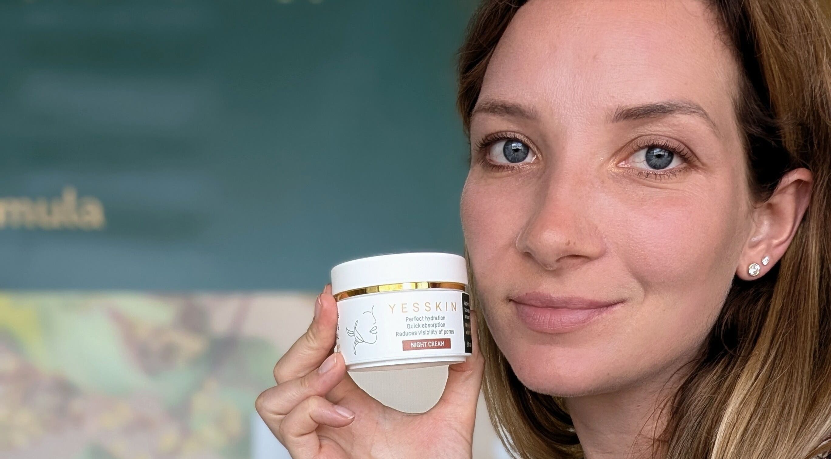 Woman holding Yesskin cream at Yesskin Skin Care, Tarpon Springs, Florida, US.