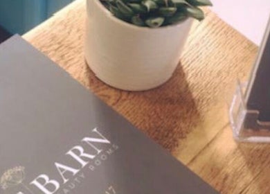 Reception desk at The Barn Beauty Rooms, showcasing brochures in Norwich, England, GB.