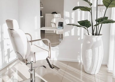 Bright salon chair and plants at Tomeeka Jay Beauty Collective, Buronga, New South Wales, AU.