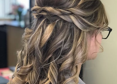 Elegant braided hairstyle crafted at Salon Cecy and Color Studio, Bolingbrook, Illinois, US.