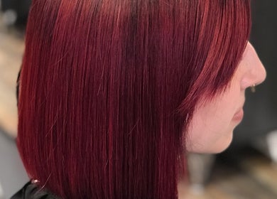 Vibrant red bob hairstyle at Salon Cecy and Color Studio in Bolingbrook, Illinois, US.