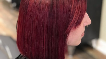 Vibrant red bob hairstyle at Salon Cecy and Color Studio in Bolingbrook, Illinois, US.