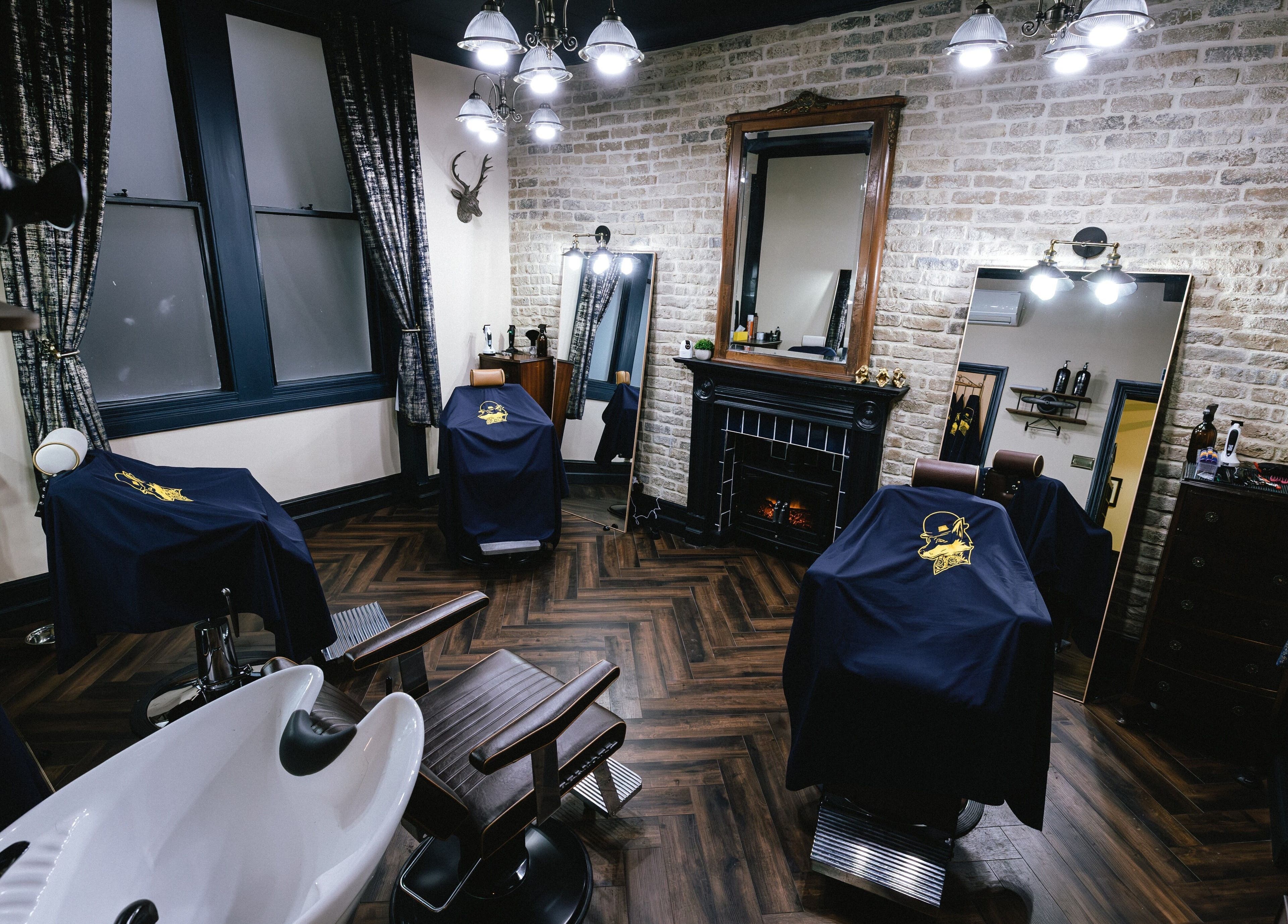Chic interior of Barber Smiths Marylebone, London, England, GB showcasing stylish chairs and decor.