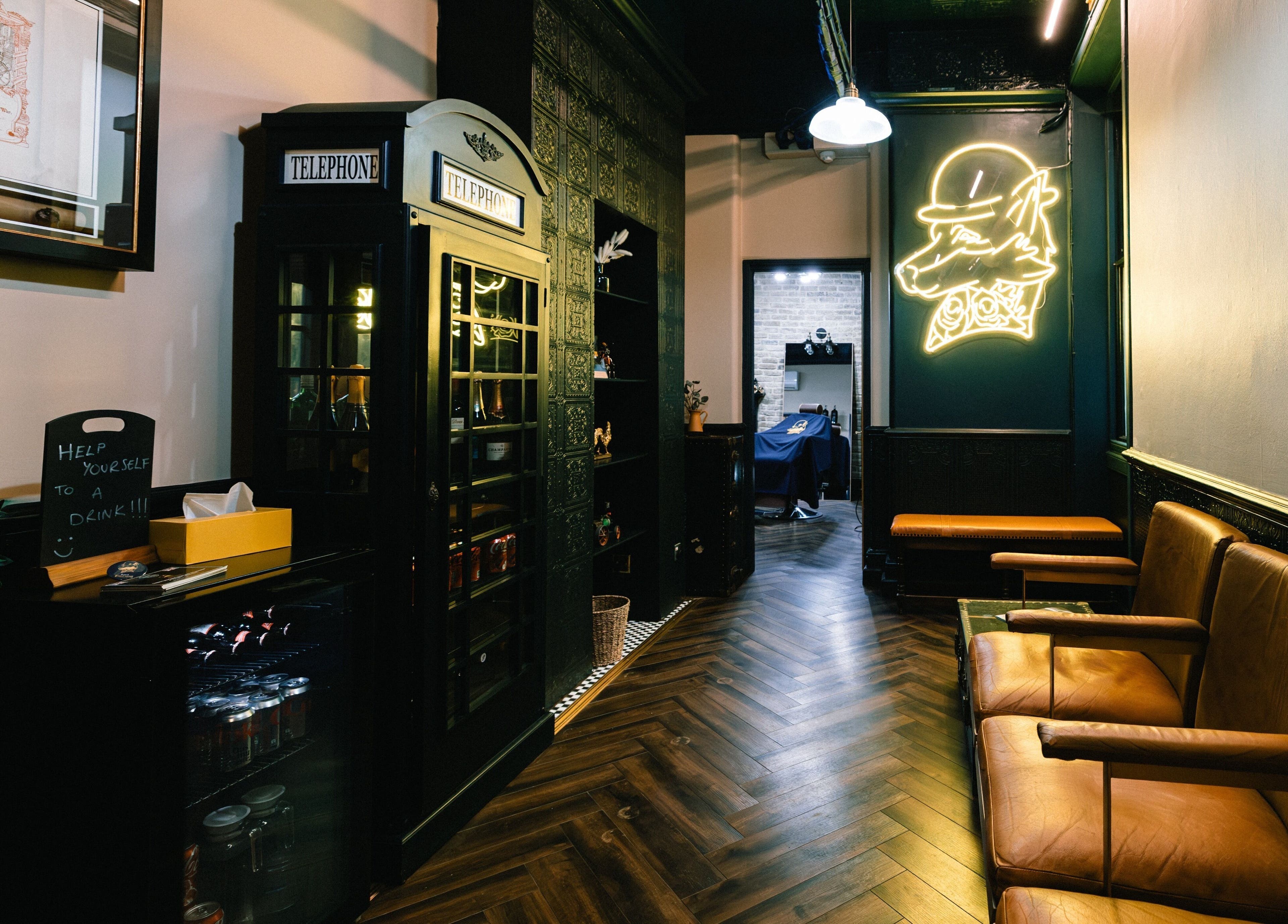 Chic interior of Barber Smiths Marylebone, London, England, GB with cozy seating and elegant decor.