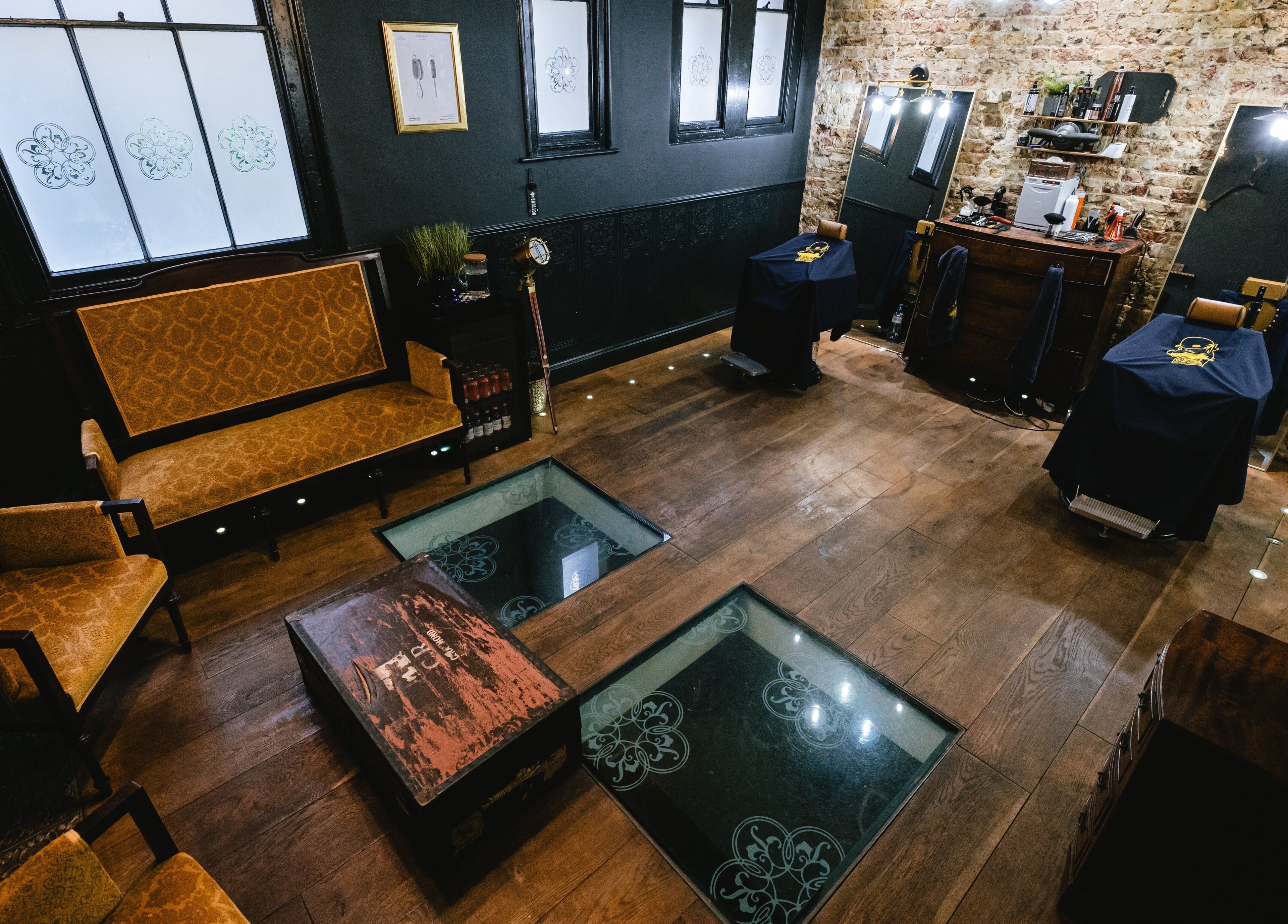 Chic vintage interior of BarberSmiths Shoreditch in London, England, GB with stylish seating and rustic decor.