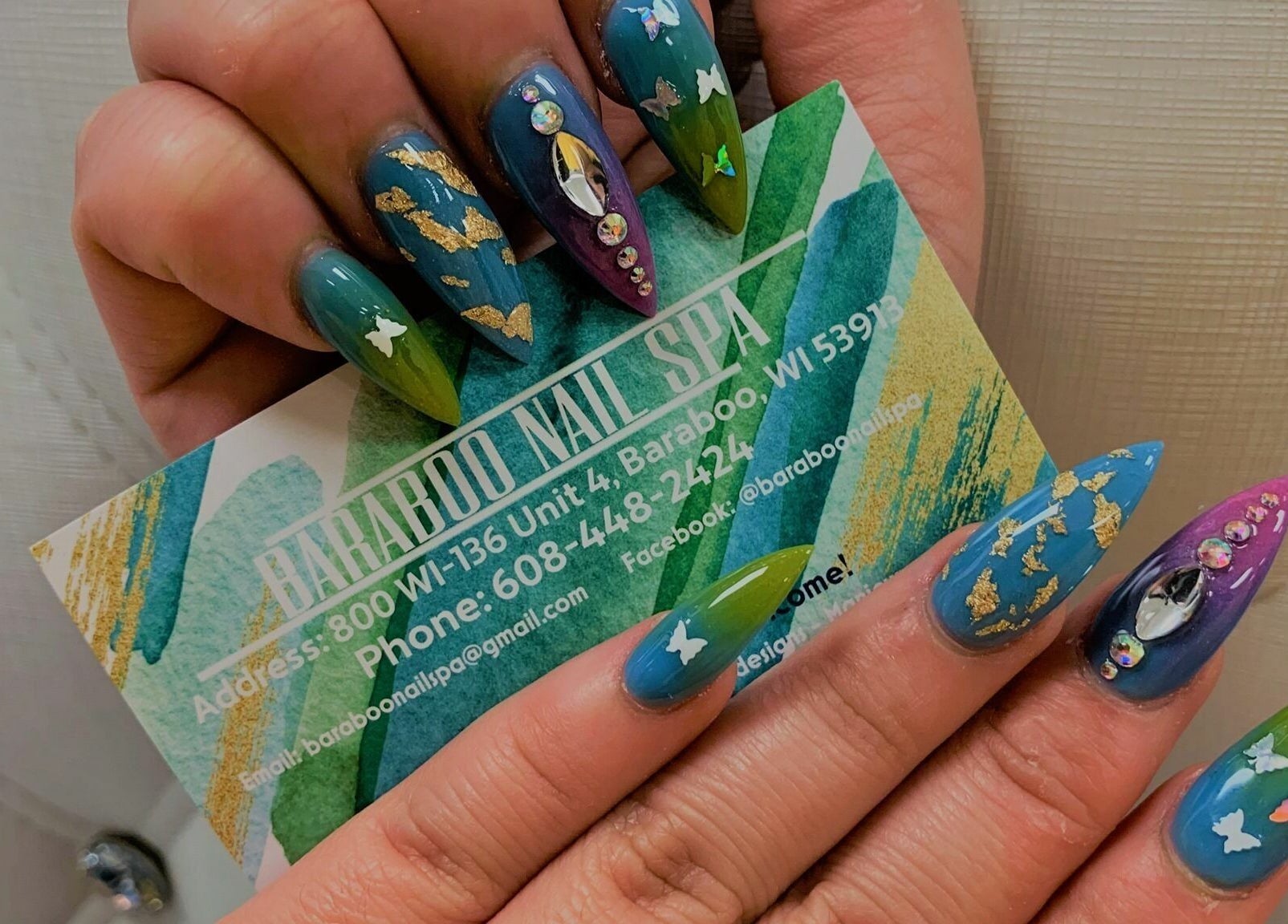 Unique nail art at Baraboo Nail Spa, Baraboo, Wisconsin, US, featuring vibrant designs and embellishments.