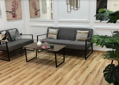 Spacious lounge at Al-Fal Beauty Center | Abu-Dhabi with plush seating, decor, and plants, أبو ظبي, أبو ظبي, AE.