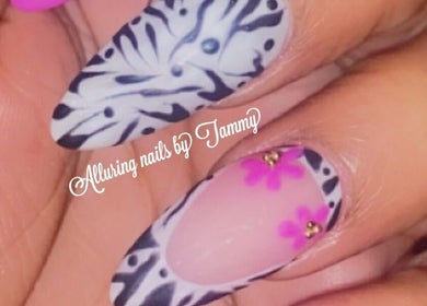 Zebra-striped and pink floral nails at Alluring Nails by Tammy, New Providence, BS.