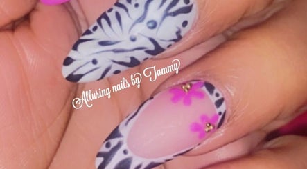 Zebra-striped and pink floral nails at Alluring Nails by Tammy, New Providence, BS.
