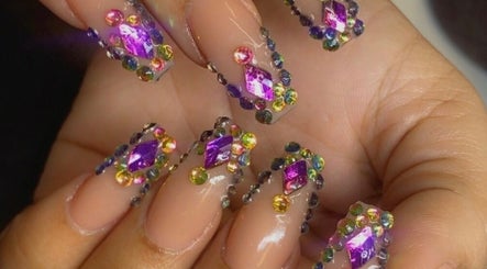 Intricate gemstone nail art at Alluring Nails by Tammy, New Providence, BS.