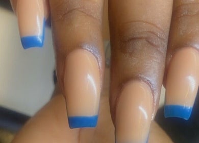 Stylish blue-tipped manicure at Alluring Nails by Tammy, New Providence, BS.