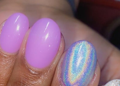 Vibrant nails with holographic and glitter accents by Alluring Nails by Tammy, New Providence, BS.