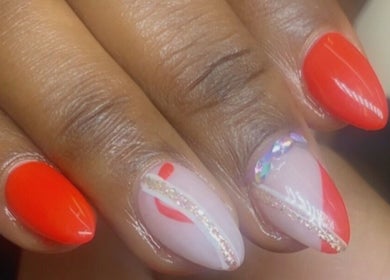 Elegant nail art featuring red designs by Alluring Nails by Tammy in New Providence, BS.